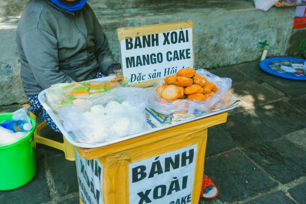 A Person Selling Traditional Cakes on a Street
