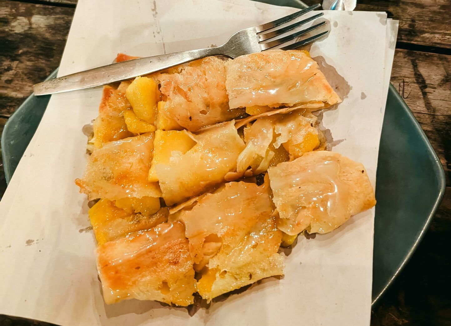 Mango and banana-filled pastries on plates, ready to enjoy. Perfect for dessert.